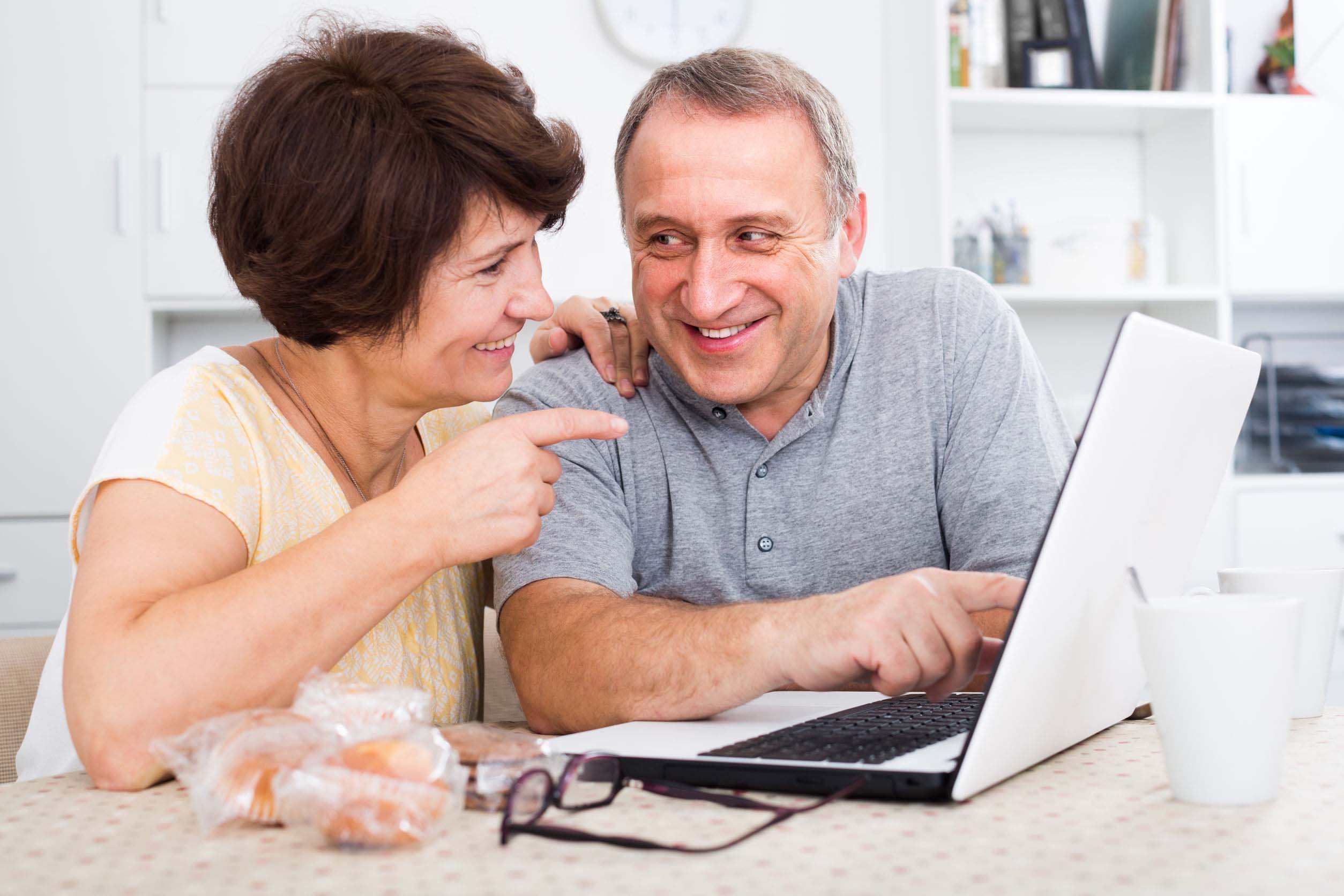Older Couple looking at laptop